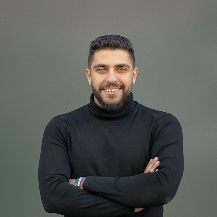 Alex Morgan, Lead Design Curator at LumenMistGrove, reviewing corporate floral arrangements